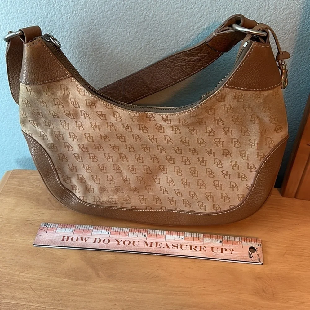 Dooney and Bourke classic monogram canvas and leather Tan color small hobo bag